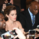 Moments of loving fans: Emma Watson is seen signing autographs for fans as she arrives at the premiere of “Beauty and the Beast”