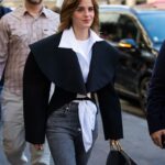 “Chic and Casual: Emma Watson Rocks Skinny Jeans and Dr. Martens at Schiaparelli Haute Couture Show”