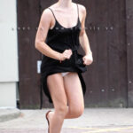 Emma Watson’s Street Chic: A Stylish Dash in a Black Two-Piece Dress Sets the Fashion Pace!