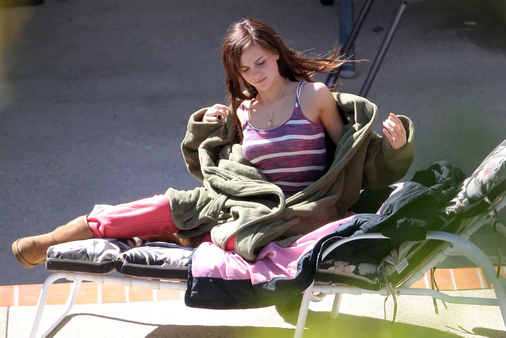 Relaxing Respite: Emma Watson Takes a Moment on the Set of “The Bling Ring” in Los Angeles