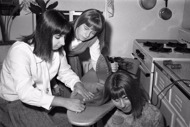 Teenage Girls Iron Their Hair Before a Night Out in New York City, 1964 _ US