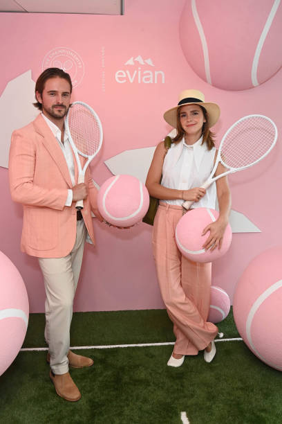 Alex Watson and Emma Watson pose in the evian VIP Suite on day fourteen of Wimbledon 2023